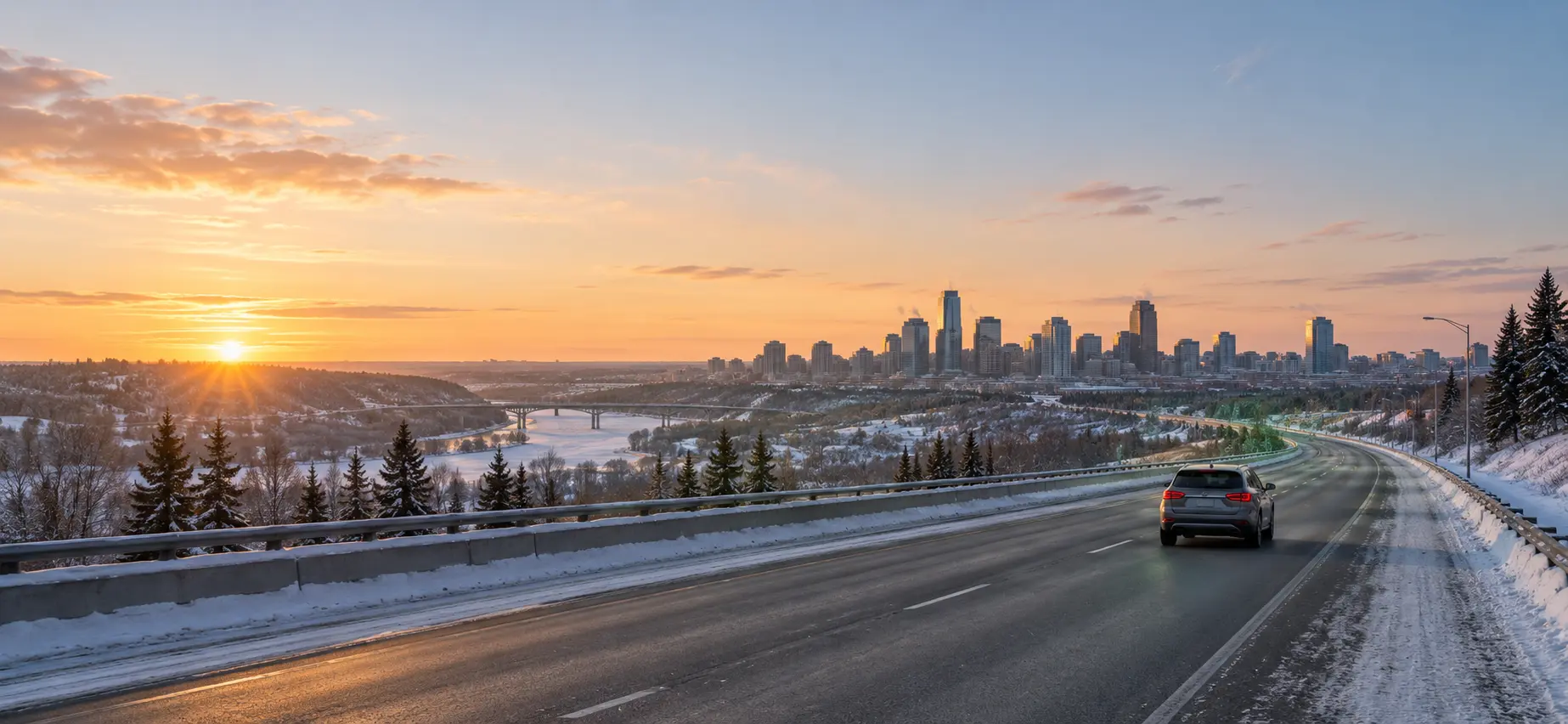 Conceptual winter sunrise view of a vehicle travelling towards Edmonton.